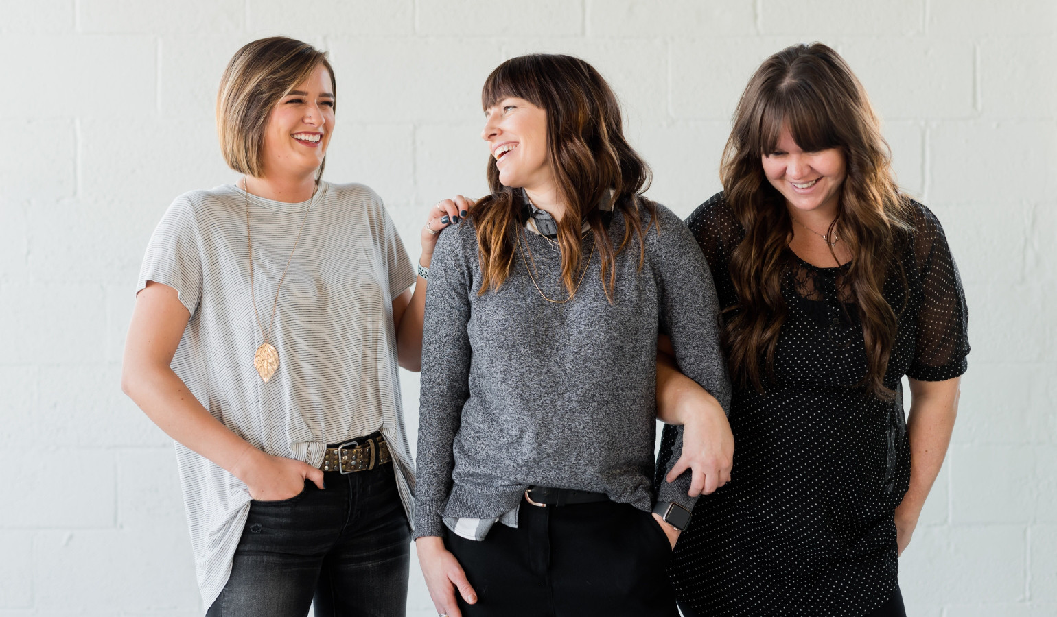 three young women smiling