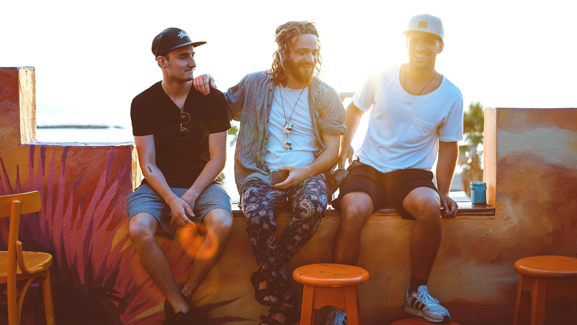 three male friends sitting together