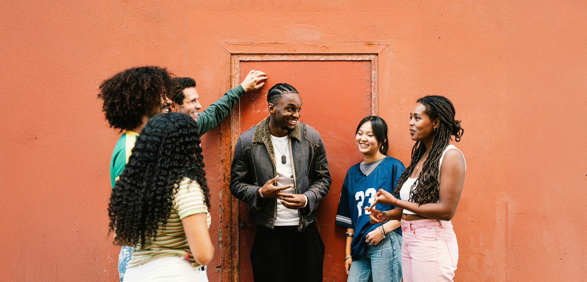Group of young people talking and enjoying each other's company