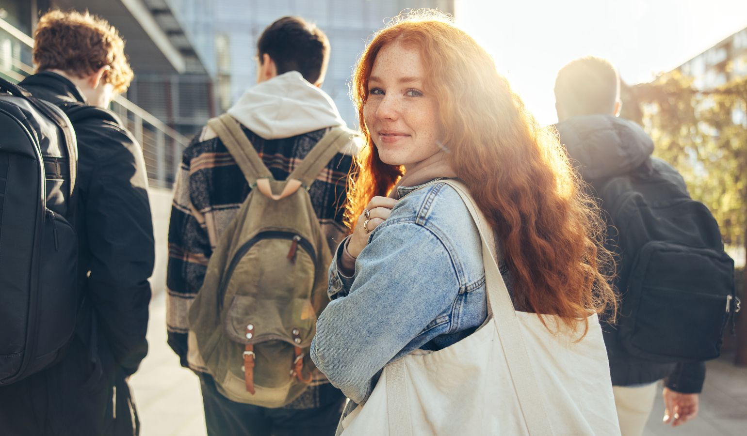 Female teenage student looks over shoulder