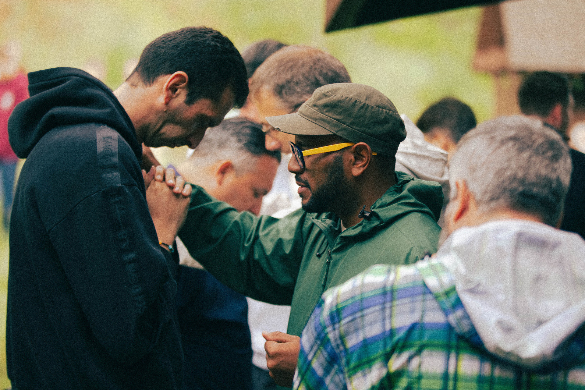 People praying over each other