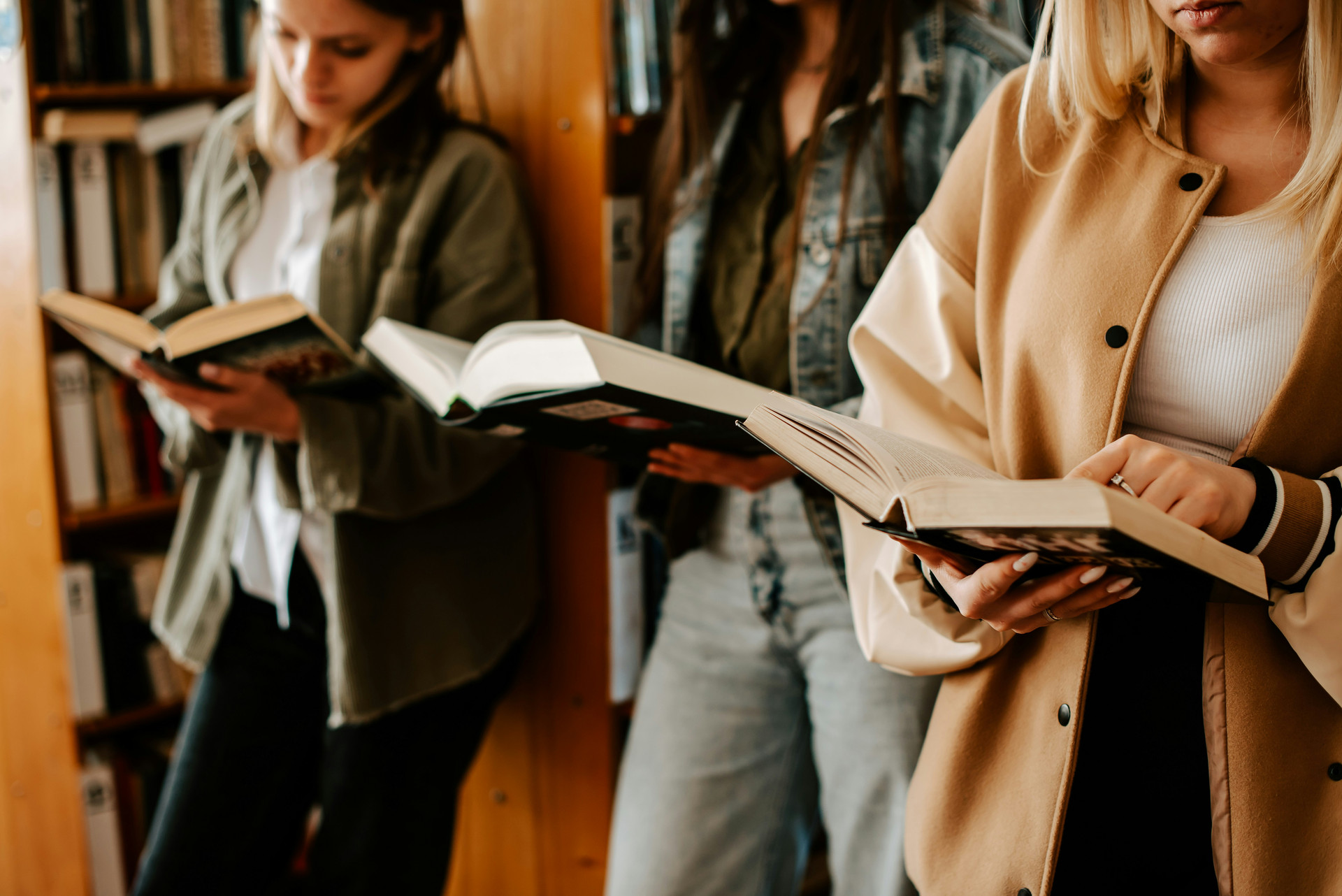 Youth in a library reading books