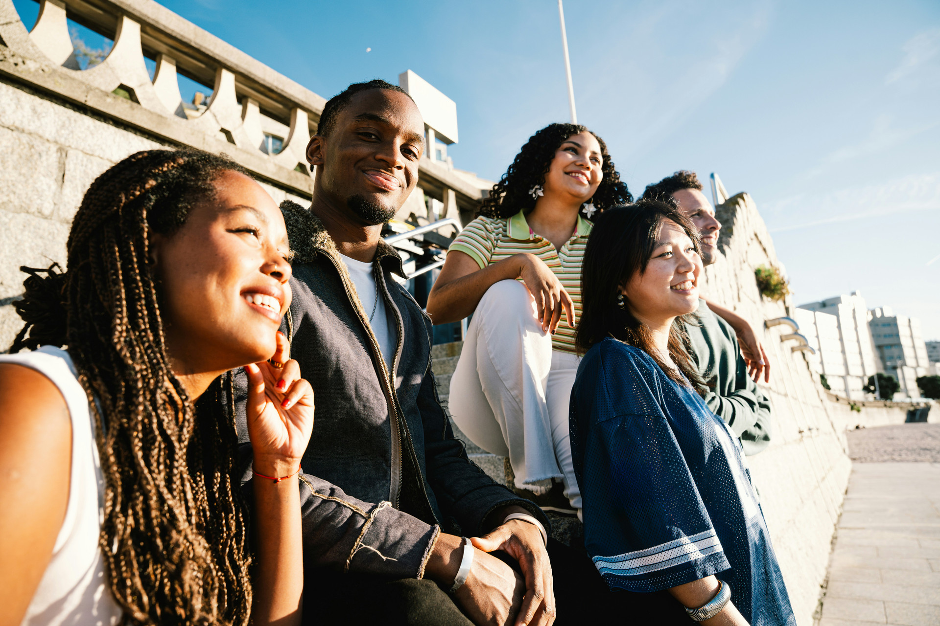 Students gathered near boardwalk looking to the horizon.