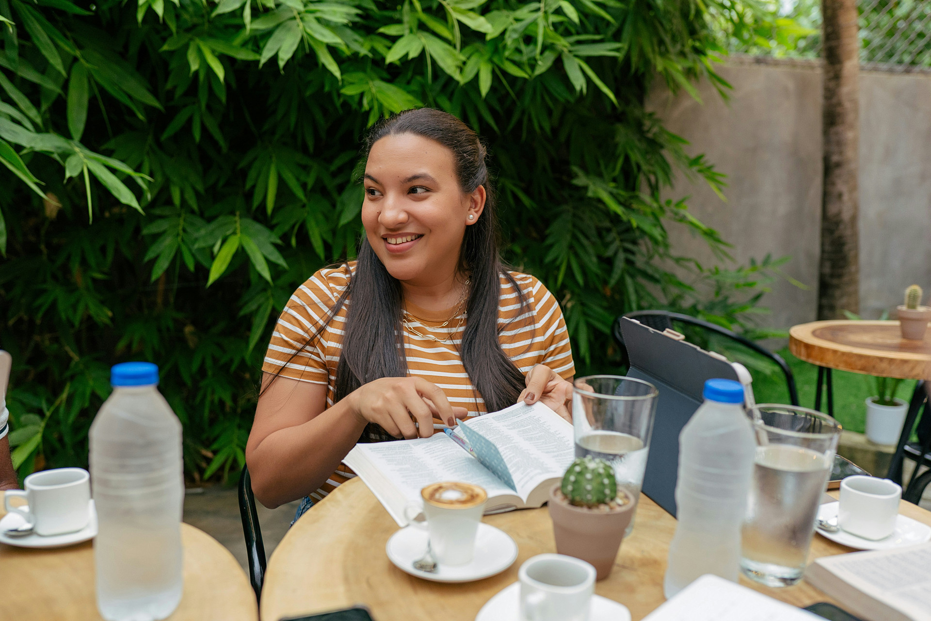Youth Leader at a table with Bible